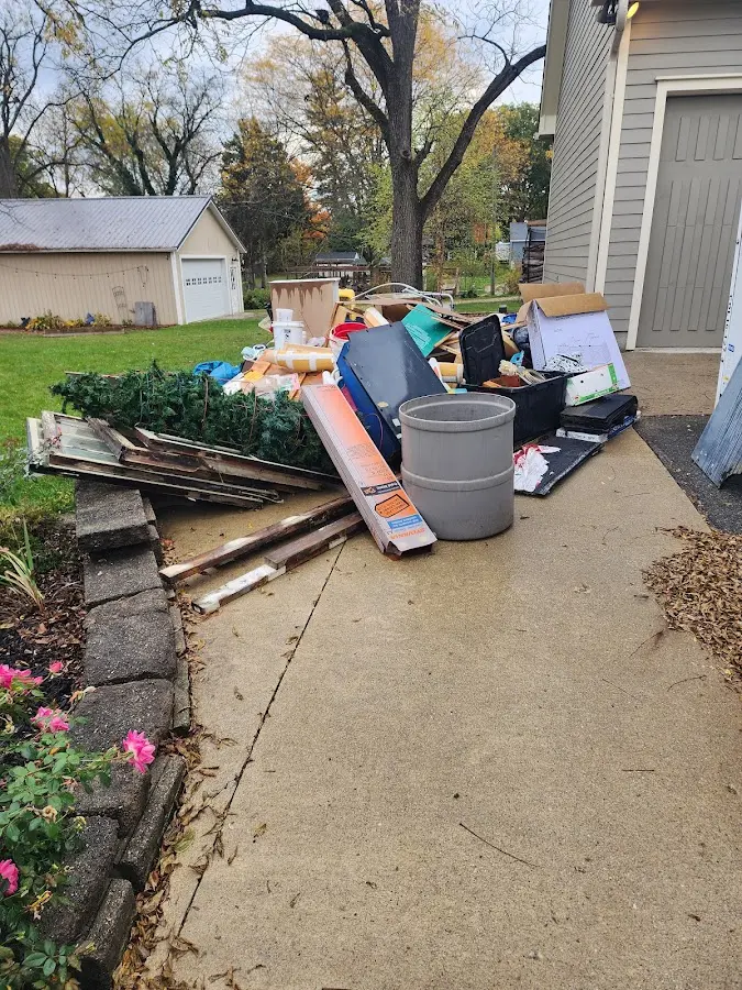 Dumpster being loaded with debris for Residential Dumpster Rental in Highgrove